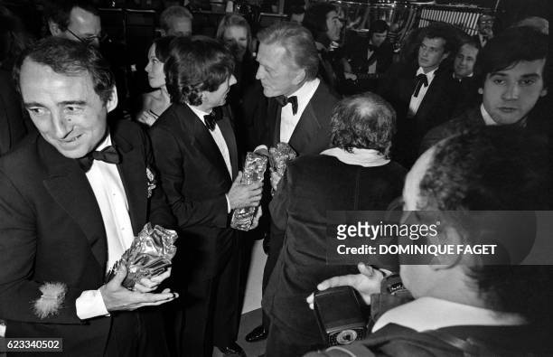 , French actor Claude Brasseur, Polish French director Roman Polanski and US actor Kirk Douglas are pictured during 5th nuit des Cesar ceremony, on...