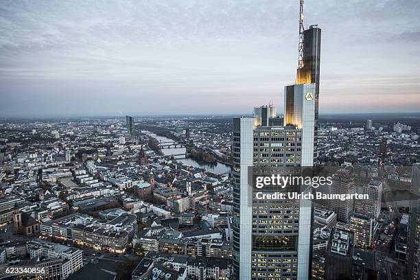 The Frankfurt banking district in the Blue Hour. The photo shows the head office of Commerzbank AG and a part of Frankfurt with the river Main. Main.