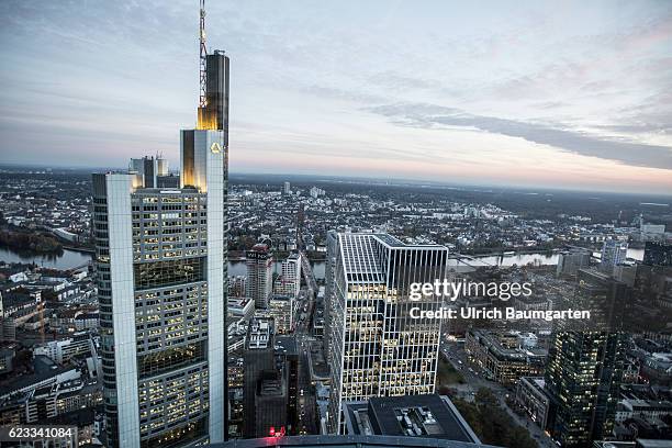 The Frankfurt banking district in the Blue Hour. The photo shows the head office of Commerzbank AG and a part of Frankfurt with the river Main. Main.