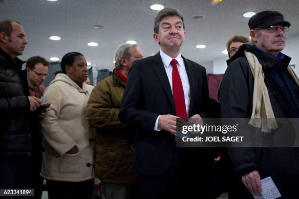 Front de Gauche leftist party's candidate for the 2012 French presidential election Jean-Luc Melenchon waits to cast his ballot in a polling station...