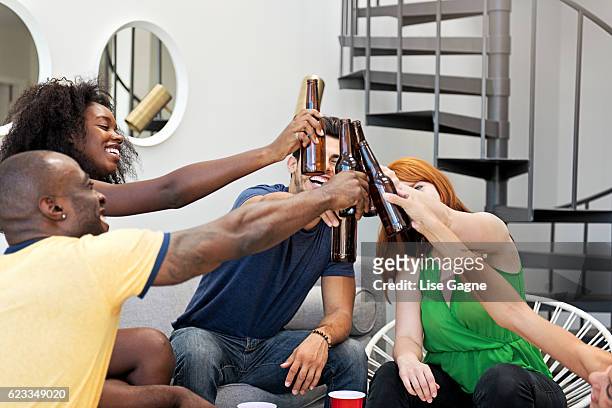 friends toasting - lise gagne stock pictures, royalty-free photos & images