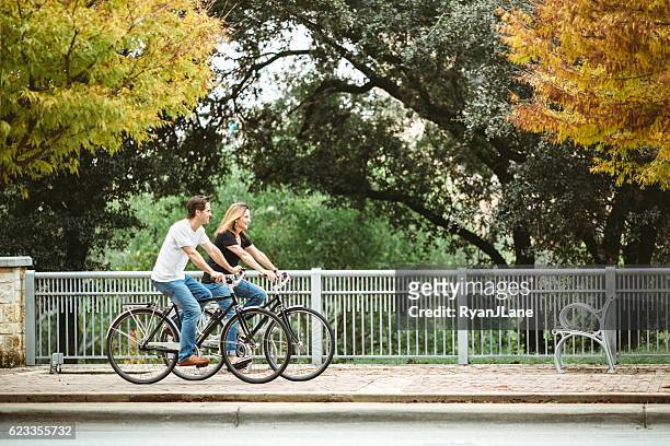 mature couple on bikes in austin texas - austin texas imagens e fotografias de stock