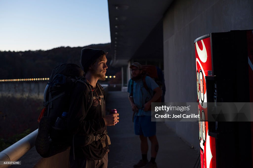 Appalachian Trail thru-hiker with Coke on Fontana Dam