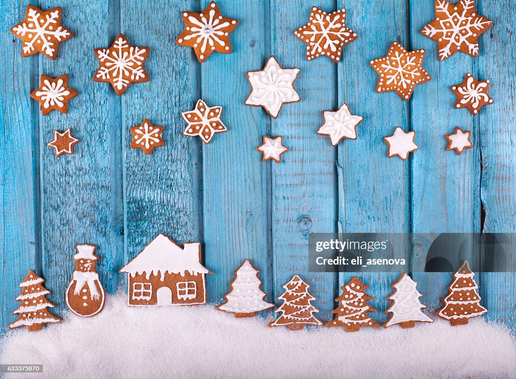 Christmas gingerbread cookies on blue vintage wooden table