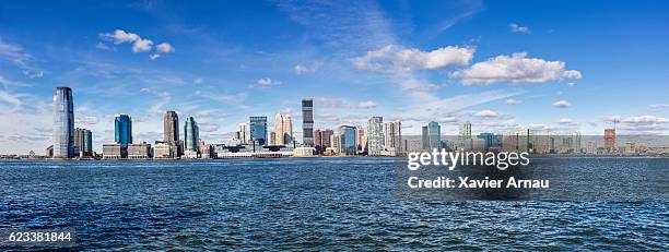 panoramic view of urban skyline of newport by river - jersey city stock pictures, royalty-free photos & images