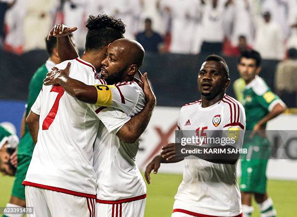 Players Ali Mabkhout , Ismail Matar , and Ismail Al Hammadi celebrate their victory during the 2018 World Cup qualifying football match between Iraq...
