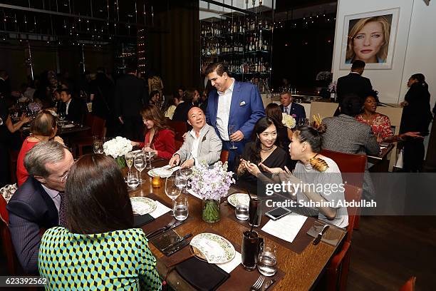 Guests mingle during the Michael Kors Mandarin Gallery Flagship Store Opening Private Dinner at CUT at Marina Bay Sands on November 15, 2016 in...