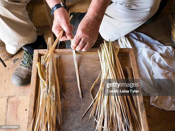 Man demonstrating the traditional handicraft of weaving palm fronds at a small museum in Zingaro Nature Reserve, a scenic coastal reserve in Trapani...