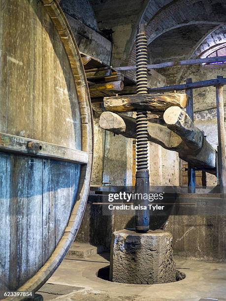 An old wooden wine press at Grazi Wines, one of the new generation of natural wineries working with indigenous grape varieties, outside of...