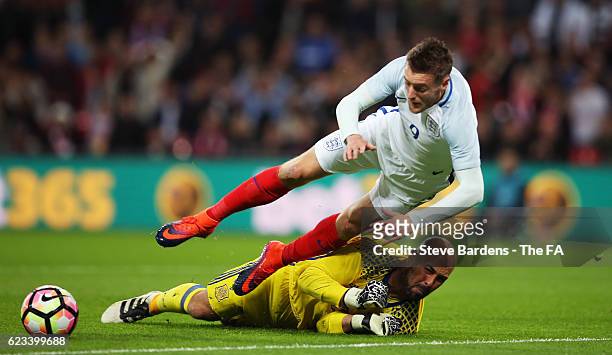 Jamie Vardy of England isbrought dow by goalkeeper Pepe Reina of Spain to concede a penalty during the international friendly match between England...