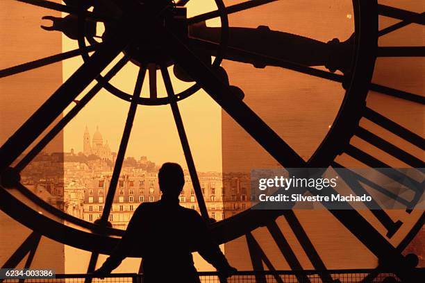 person and clock face - musee d'orsay stock pictures, royalty-free photos & images