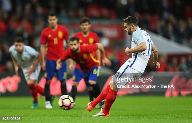 Adam Lallana of England scores the opening goal from the penalty spot during the international friendly match between England and Spain at Wembley...
