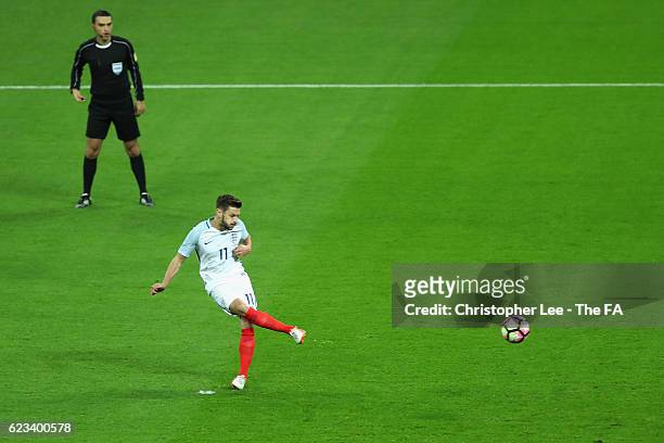 Adam Lallana of England scores the opening goal from the penalty spot during the international friendly match between England and Spain at Wembley...