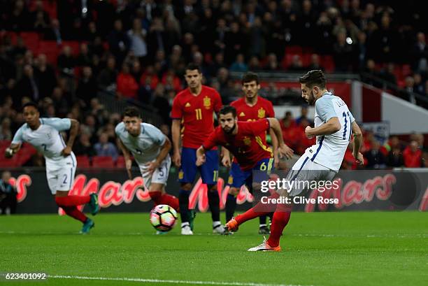 Adam Lallana of England scores the opening goal of the game from the penalty spot during the international friendly match between England and Spain...