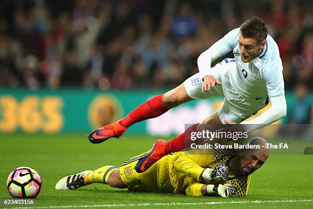 Jamie Vardy of England isbrought dow by goalkeeper Pepe Reina of Spain to concede a penalty during the international friendly match between England...