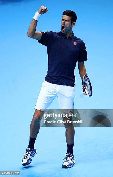 Novak Djokovic of Serbia celebrates a point during his men's singles match against Milos Raonic of Canada on day three of the ATP World Tour Finals...