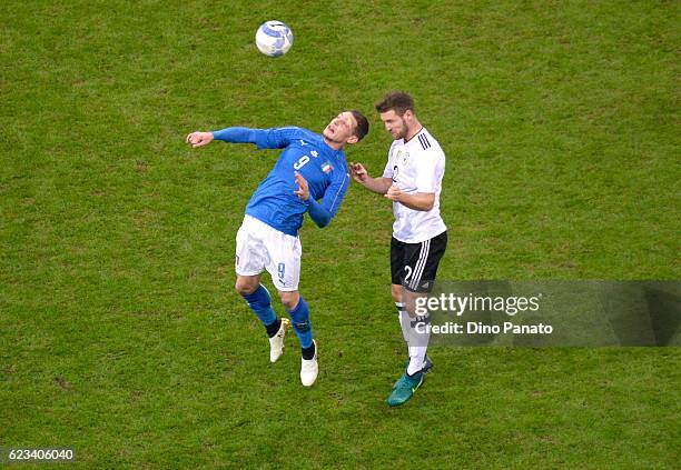 Andrea Belotti of Italy competes with Shkodran Mustafi of Germany during the International Friendly Match between Italy and Germany at Giuseppe...