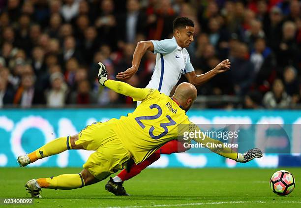 Jesse Lingard of England takes on goalkeeper Pepe Reina of Spain during the international friendly match between England and Spain at Wembley Stadium...