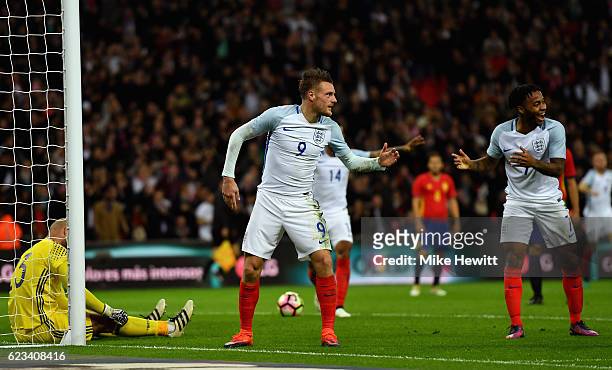 Jamie Vardy of England celebrates with Raheem Sterling as he scores their second goal during the international friendly match between England and...
