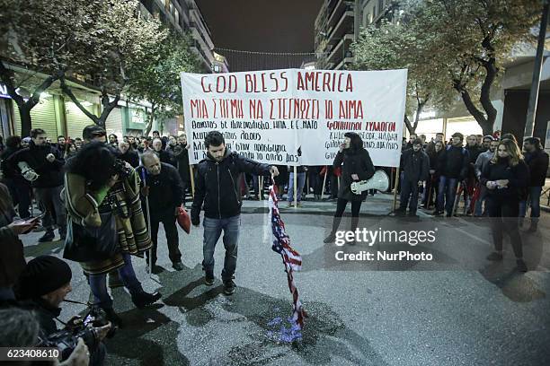 Protestors burn a US flag during a demonstration against the visit of the US president in Thessaloniki on November 15, 2016. US President Barack...