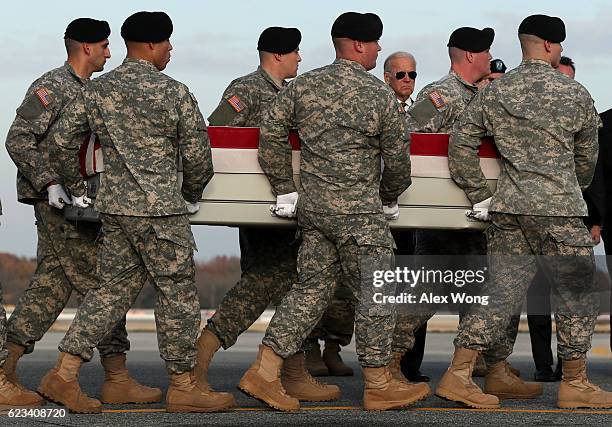 Members of a U.S. Army carry team move the flag-draped transfer case holding the remains of Army Pfc. Tyler R. Iubelt of Tamaroa, Illinois, as they...