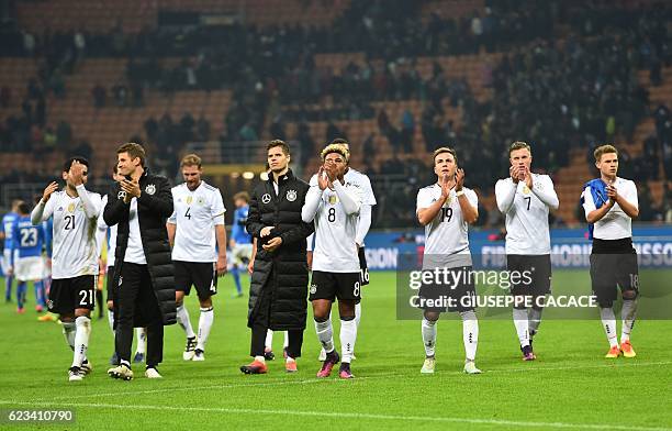 Germany's players greet fans at the end of the International friendly football match Italy vs Germany on November 15, 2016 at the 'San Siro Stadium'...
