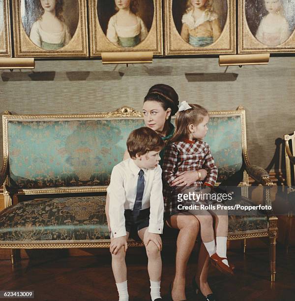 Members of the British Royal Family, Princess Margaret, Countess of Snowdon pictured holding her children, David Armstrong-Jones, Viscount Linley and...