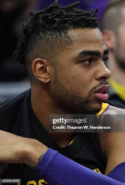 Angelo Russell of the Los Angeles Lakers looks on from the bench against the Sacramento Kings during an NBA basketball game at Golden 1 Center on...