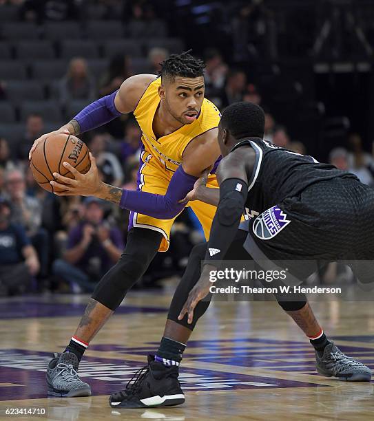 Angelo Russell of the Los Angeles Lakers looks to put a move on Darren Collison of the Sacramento Kings during an NBA basketball game at Golden 1...