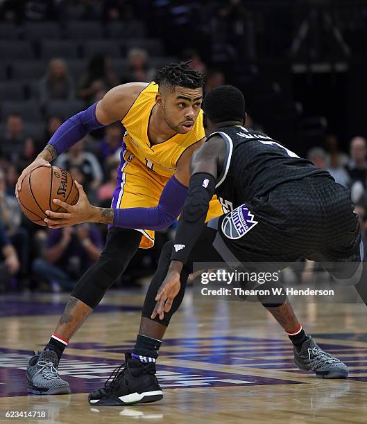 Angelo Russell of the Los Angeles Lakers looks to put a move on Darren Collison of the Sacramento Kings during an NBA basketball game at Golden 1...