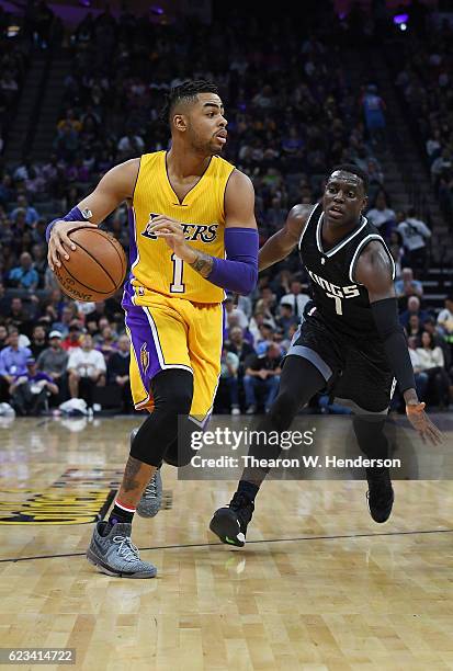 Angelo Russell of the Los Angeles Lakers dribbles the ball past Darren Collison of the Sacramento Kings during an NBA basketball game at Golden 1...