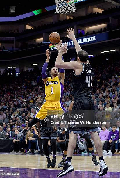 Angelo Russell of the Los Angeles Lakers shoots over Kosta Koufos of the Sacramento Kings during an NBA basketball game at Golden 1 Center on...