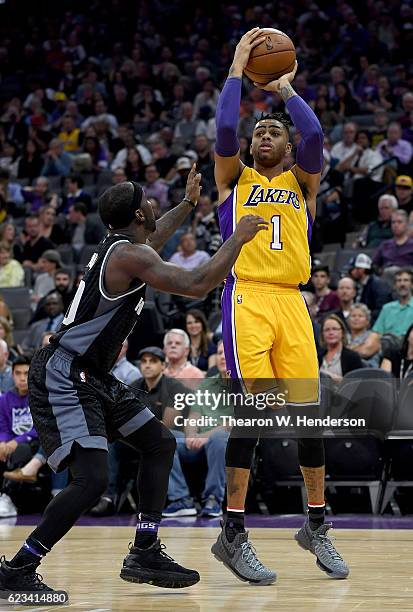 Angelo Russell of the Los Angeles Lakers shoots over Ty Lawson of the Sacramento Kings during an NBA basketball game at Golden 1 Center on November...