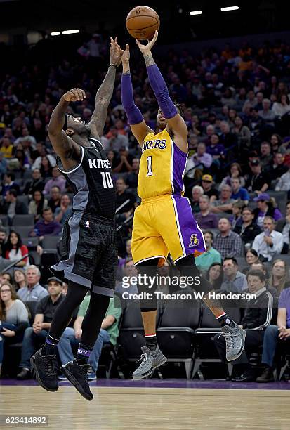 Angelo Russell of the Los Angeles Lakers shoots over Ty Lawson of the Sacramento Kings during an NBA basketball game at Golden 1 Center on November...