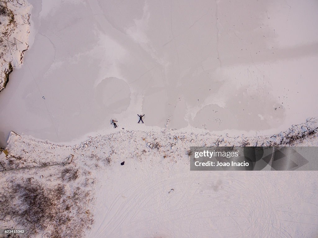Aerial view of two women playing on the snow - Finland