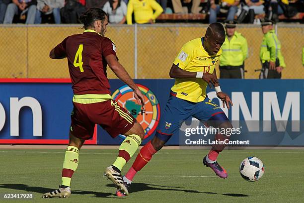 Enner Valencia of Ecuador battles a ball with Oswaldo Vizcarrondo of Venezuela during a match between Ecuador and Venezuela as part of FIFA 2018...