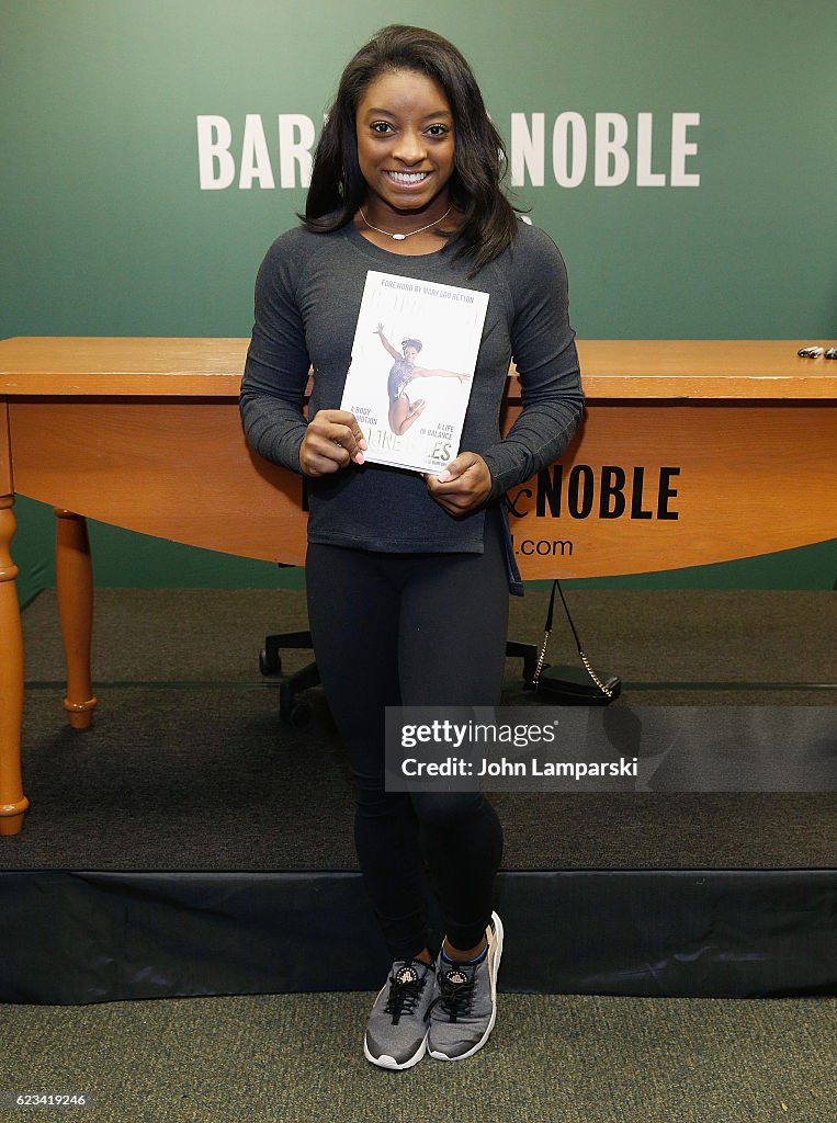 Simone Biles Signs Copies Of "Courage to Soar: A Body in Motion, A Life in Balance"