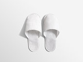 Pair of blank soft white home slippers, design mockup