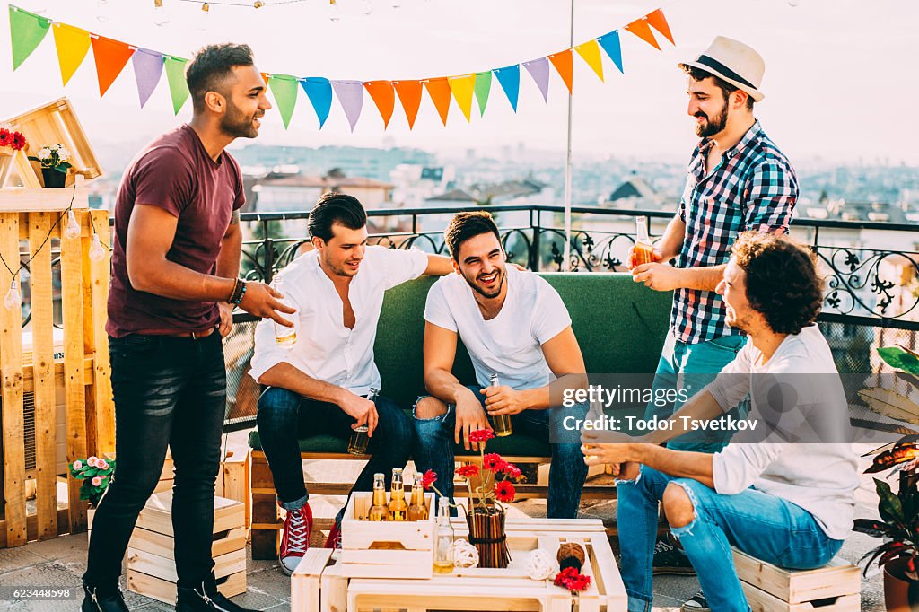 Friends having a party on the roof