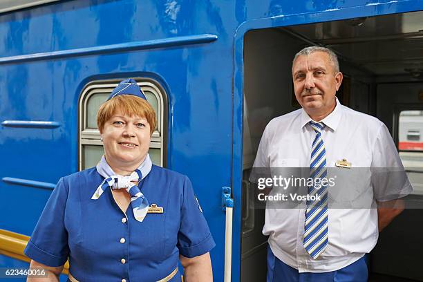 portrait of a train conductor - railroad conductor stock pictures, royalty-free photos & images