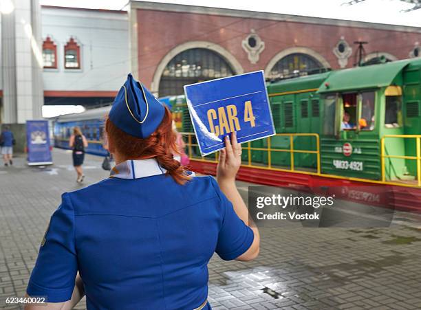 the conductor of trans-siberian express train in moscow raiwaystation - moscow railway station stock pictures, royalty-free photos & images