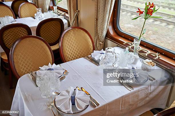 dining table in the dining car - dining car stock pictures, royalty-free photos & images