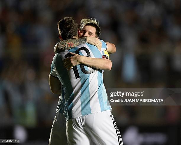 Argentina's Lucas Pratto celebrates with teammate Lionel Messi after scoring against Colombia during their 2018 FIFA World Cup qualifier football...