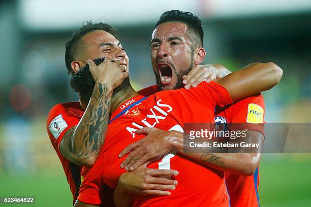 Alexis Sanchez of Chile celebrates with teammates after scoring the second goal of his team during a match between Chile and Uruguay as a part of...
