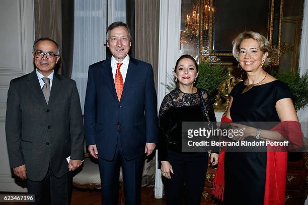 Belgium Ambassador to France, Vincent Mertens de Wilmars , his wife Marie-Joelle , Morocco's ambassador in France Chakib Benmoussa and his wife...