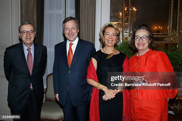 Belgium Ambassador to France, Vincent Mertens de Wilmars and his wife Marie-Joelle standing between Monaco Ambassador to France, Claude Cottalorda...