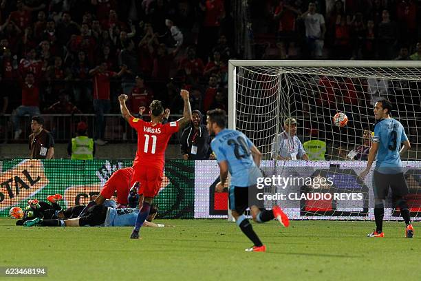 Chile's forward Alexis Sanchez scores against Uruguay during their 2018 FIFA World Cup qualifier football match in Santiago, on November 15, 2016. /...