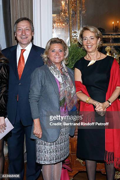 Owner of Champagne Duval-Leroy, Carol Duval-Leroy standing between Belgium Ambassador to France, Vincent Mertens de Wilmars and his wife Marie-Joelle...