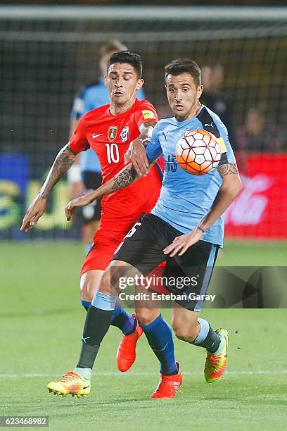 Pedro Hernandez of Chile fights for the ball with Matias Vecino of Uruguay during a match between Chile and Uruguay as part of FIFA 2018 World Cup...