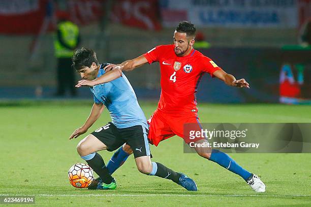 Mauricio Isla of Chile fights for the ball with Cristhian Stuani of Uruguay during a match between Chile and Uruguay as part of FIFA 2018 World Cup...